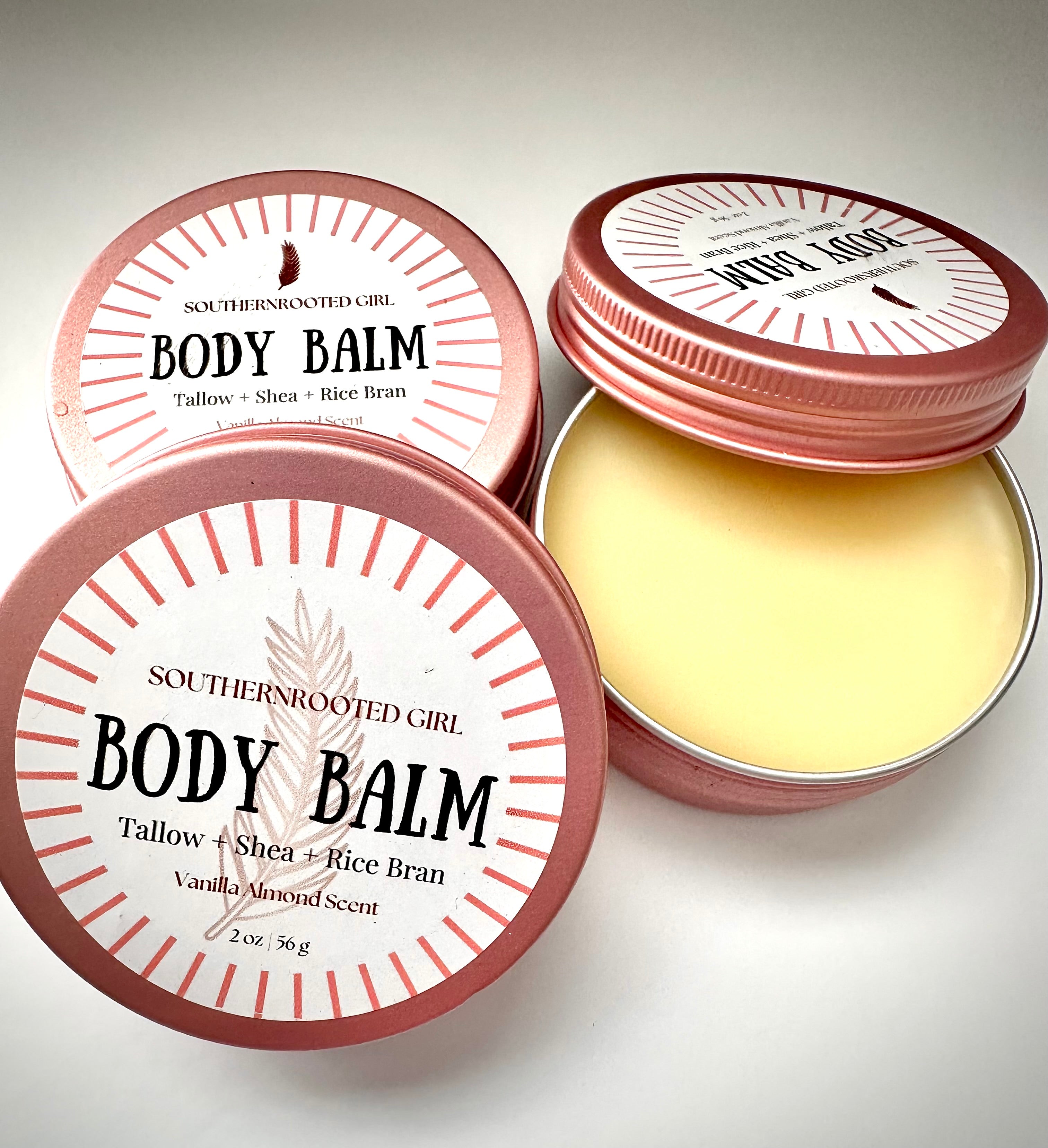Body balm in a tin with 'Southern Rooted Girl' branding on a light background