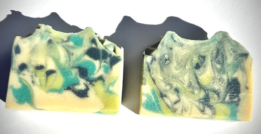 Two green and blue soap bars on a white background